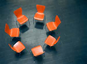 Unity is represented by all the chairs being the same color and all together in a circle. 